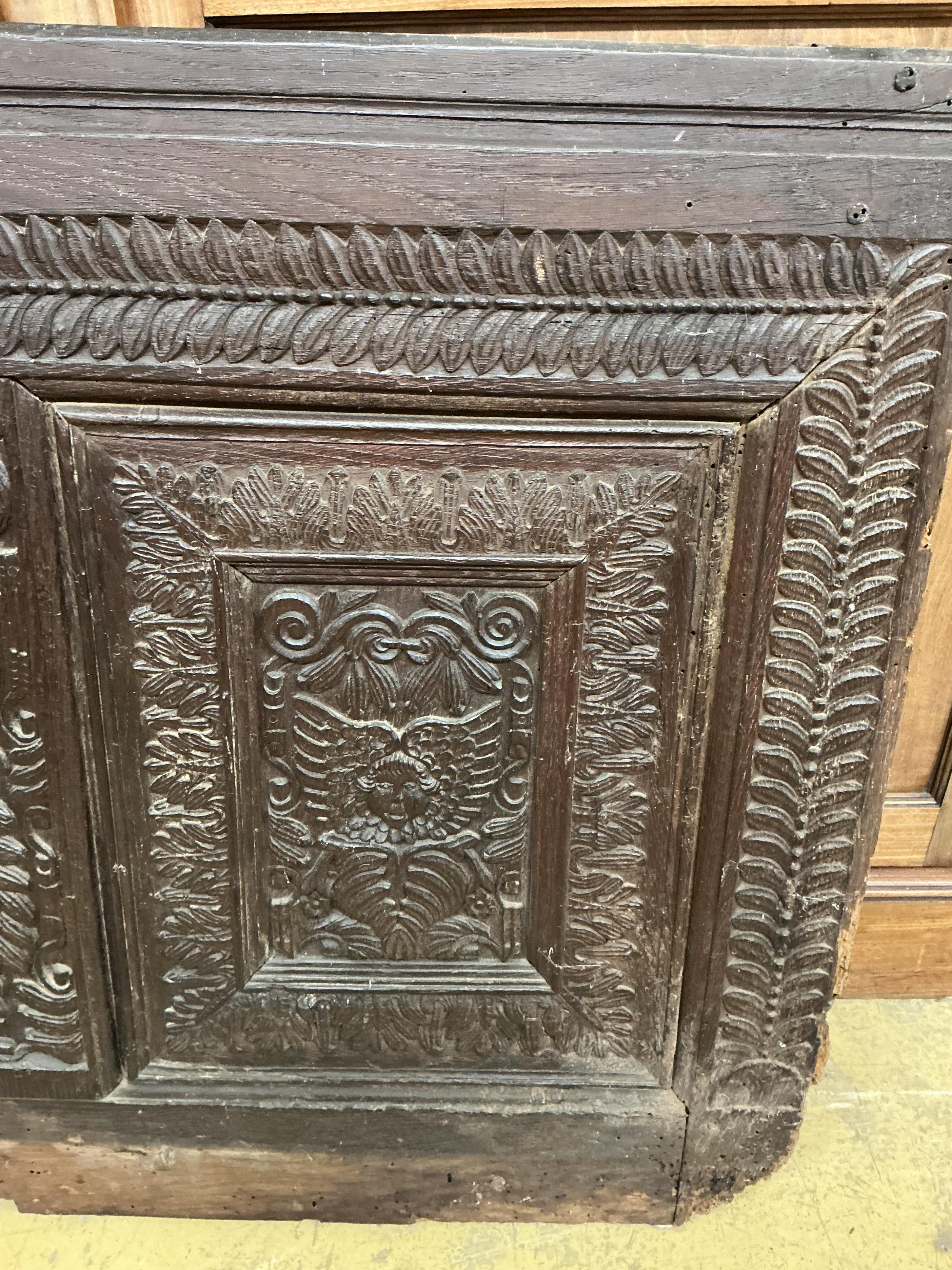 A 17th century carved oak panel, width 126cm, height 86cm